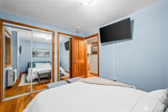 Mirrored closets run the length of the bedroom.