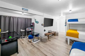 Just off from the game room is the utility space providing additional storage. Notice the durable flooring!