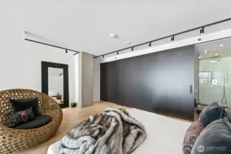 Upstairs, discover the expansive primary bedroom, complete with an ensuite bathroom and a walk-in closet, both offering sliding doors for enhanced privacy