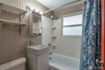 Bathroom next to two bedrooms