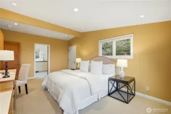 A view toward the 3/4 bath and laundry room, conveniently located off the primary bedroom.