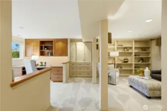 The lower level family room features two built-in work stations.