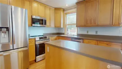 Stainless appliances can be found in this bright and open kitchen