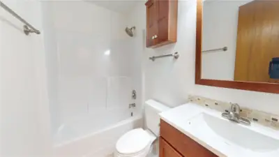 A full bath can be found in the hallway of this rambler