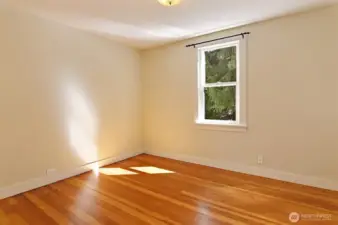 Second of two generous main floor bedrooms.