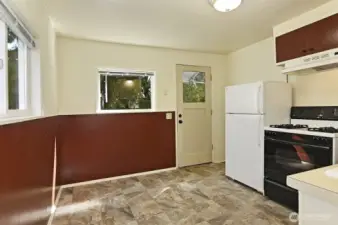 Full kitchen and separate entrance in daylight apartment.