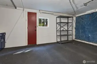 Garage currently used as large, shared storage.