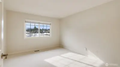 One of three spacious secondary bedrooms overlooks the golf course