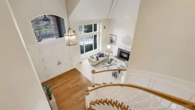 Make a grand entrance down the curved stairway. The lofted ceiling lends grandeur to the foyer.