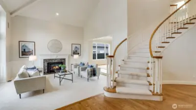 Dramatic circular staircase welcomes you into this Murray Franklin built home.