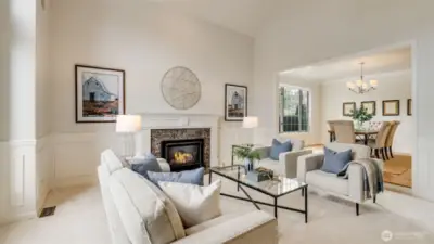 Timeless wainscot and gas fireplace with marble surround add to the cozy elegance