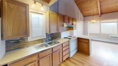 Kitchen going toward the dining area. Photo is digitally altered.