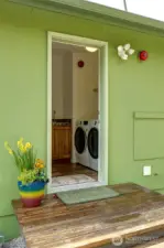 The back entry leads into the laundry room, providing easy access to the kitchen for unloading groceries or a convenient spot to leave muddy boots before entering the rest of the home.