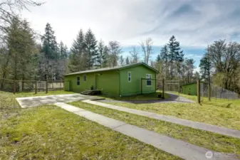 The driveway and parking pad are substantial.  The 6" deep parking pad of poured concrete is sturdy enough to hold a garage or carport, or even an ADU.