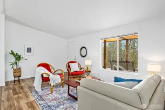 Another angle of the sitting area showcases its abundant natural light and inviting ambiance.