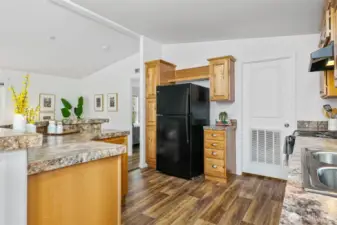 With ample counter space for food prep and like-new appliances, this home feels fresh and barely lived in.