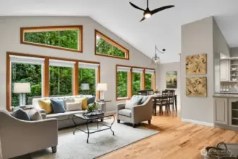 Living room with cathedral ceilings and gorgeous view windows.