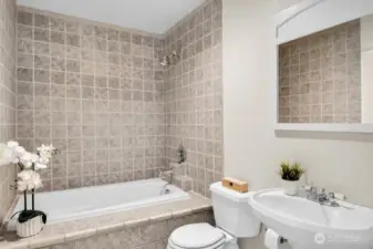 Primary bedroom with a soaking tub & shower.