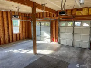 Roomy 2 door garage with separate openers and a workbench & cabinets(not pictured).