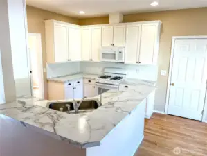 Plenty of cabinetry and attractive backsplash tile.