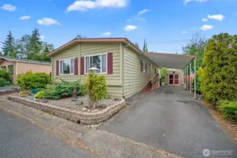 Covered parking and space for 2 cars on the driveway.