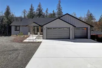 One level home with a three car garage and no steps into the home.
