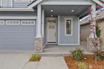Large, covered front porch welcomes you. Perfect for sitting outside and staying out of inclement weather.