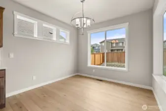 Lovely dining nook with tons of natural light flowing through.