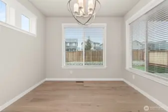 Lovely dining nook with tons of natural light flowing through.