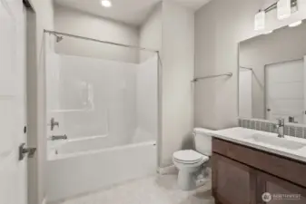 Jr. Suite full bathroom with shower/tub combo on main floor.