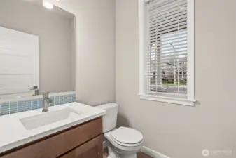 Main floor half bath is perfect for guests.