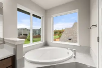 Great corner space for deep soaking tub with plenty of space for towels and bath supplies.