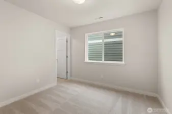 Third bedroom with 8' ceiling with a walk-in closet and prewired for internet.