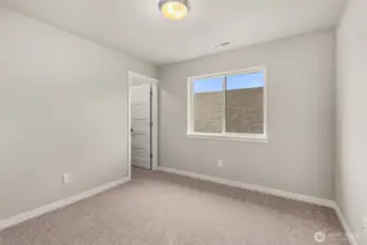 Third bedroom with 8' ceiling with a walk-in closet and prewired for internet.