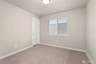 Third bedroom with 8' ceiling with a walk-in closet and prewired for internet.