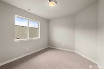 Fourth bedroom with 8' ceiling with a standard reach-in closet and prewired for internet.