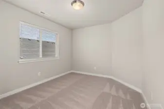 Fourth bedroom with 8' ceiling with a standard reach-in closet and prewired for internet.