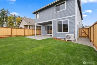 Partially covered back patio, perfect for relaxing or BBQing.