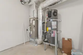High efficiency Carrier electric forced-air furnace and Electric hybrid water heater.