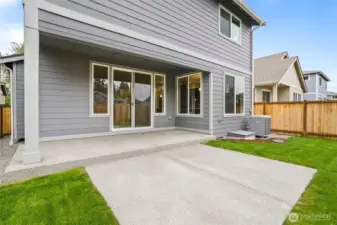 Partially covered back patio, perfect for relaxing or BBQing.