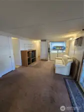 Living room with laundry closet attached