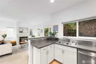 Kitchen opens to a cozy family room.