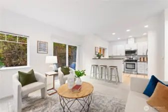 Family room with slider doors leading to the an oversized backyard patio.