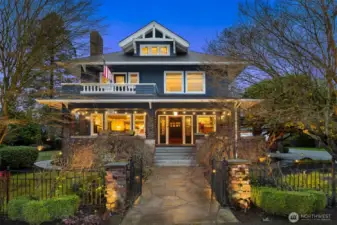 A timeless Craftsman presence anchors the heart of downtown Snohomish. Bathed in twilight glow, this iconic façade showcases classic proportions, deep overhangs, brick detailing, and a welcoming front porch—an unmistakable landmark with enduring architectural gravitas.