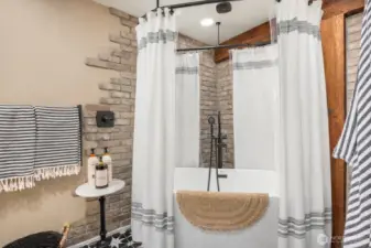 The lower level includes a stunning full bath with custom tile work and a deep soaking tub—blending spa-like comfort with design-forward finishes rarely found in basement spaces. Possibility of a MIL or STR.