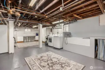 A remarkably large utility room provides exceptional functionality, featuring laundry, storage, workspace, and a dedicated pet wash station—perfect for modern living without sacrificing style or space.