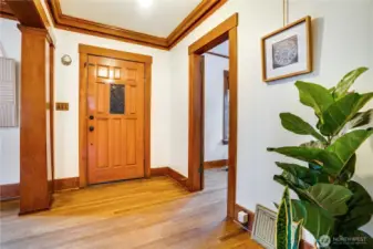 Take note of the original millwork and classic columns that define the entryway.