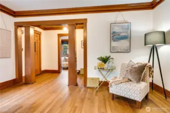 The formal entry opens seamlessly into the living room, which flows effortlessly into the dining room—creating a natural, connected layout perfect for both everyday living and entertaining.