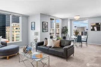Bright interior with expansive windows and urban views