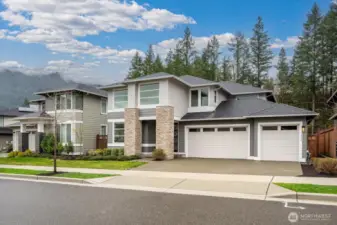 The hard-to-get 3-Car Garage: Expanded space for vehicles and Pacific Northwest gear. Equipped with a dedicated electric vehicle charging port for modern convenience.